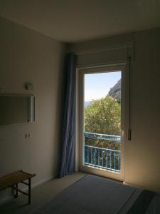 a room with a large window with a view at La Dimora di Clara in Monterosso al Mare