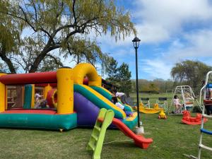 a park with a playground with a slide at Carpe Diem in Ramallo