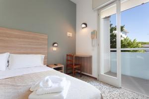 Postel nebo postele na pokoji v ubytování Hotel Admiral + 37 fotografií