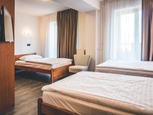 Postel nebo postele na pokoji v ubytování Sabotin, Hotel & Restaurant