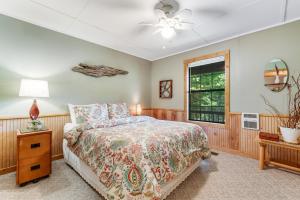 a bedroom with a bed and a window at Fresh Ayres Getaway in Banner Elk