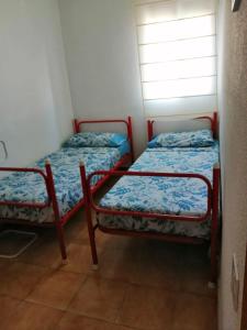 Postel nebo postele na pokoji v ubytování Coqueto apartamento + 4 fotografie