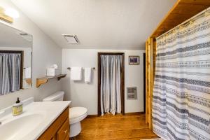 a bathroom with a toilet and a sink and a shower at The Norma Charles in South Fork +41 photos