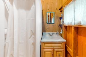 a bathroom with a sink and a mirror at KenMa Cottage in Port Clyde +28 photos