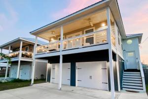 a large house with two garage doors at Blue Haven in Panama City Beach