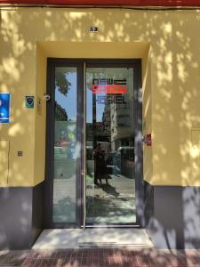 a building with a door open in front of it at New Samay Hostel in Seville