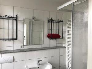a bathroom with a sink and a mirror at Gästewohnung in Schwelm in Schwelm