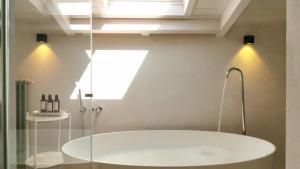 a bath tub in a bathroom with a window at Santa Lucia Maccarese - Residenza Agricola in Maccarese