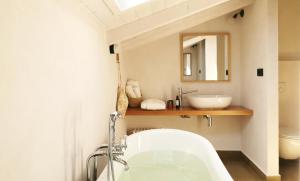 a bathroom with a sink and a bath tub at Santa Lucia Maccarese - Residenza Agricola in Maccarese