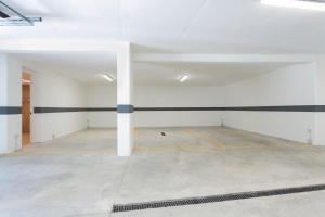 an empty garage with black and white stripes on the walls at Bellavista - Lake in Molveno