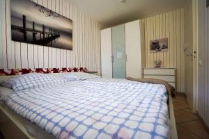 Postel nebo postele na pokoji v ubytování Hanseat I Whg 17