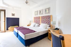 מיטה או מיטות בחדר ב-Atlas Suites Tenerife by EnjoyaHome