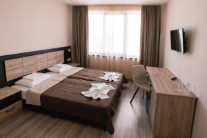 A bed or beds in a room at Hotel Terra