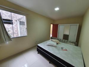 מיטה או מיטות בחדר ב-Casa Duplex Nova em Iriri