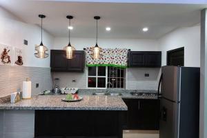 Kuchyň nebo kuchyňský kout v ubytování 4to nivel 2 habitaciones 2 baños Alma Rosa I