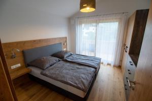 Un pat sau paturi într-o cameră la Der Bienenkorb