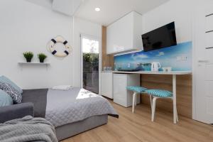 Televisyen dan/atau pusat hiburan di Rooms of Poland (500m od Suntago) +28 gambar