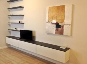 a room with a desk with a tv on a wall at Pescara Center Apartment in Pescara