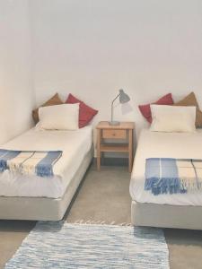 Postel nebo postele na pokoji v ubytování Casa dos Retratos Faro