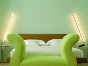 Postel nebo postele na pokoji v ubytování Petronilla - Hotel In Bergamo