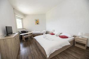 Rúm í herbergi á Hotel Fit Fun