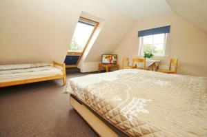 Ένα ή περισσότερα κρεβάτια σε δωμάτιο στο Narzisse