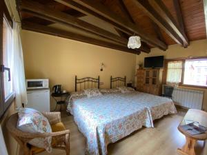 Postel nebo postele na pokoji v ubytování Casa Rural Era de Ferro