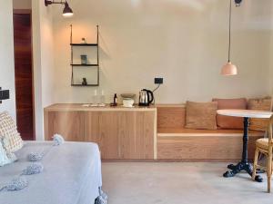 a living room with a couch and a table at Santa Lucia Maccarese - Residenza Agricola in Maccarese