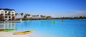 a large swimming pool with kayaks in the water at THE BLYDE CRISTAL LAGOON in Pretoria
