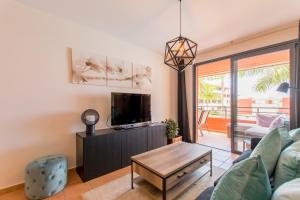 A television and/or entertainment centre at Duplex Paraiso Dream - TENESOL RENTALS