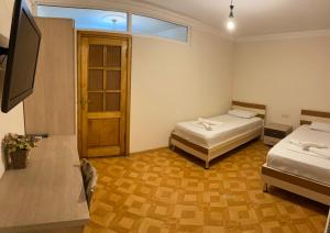 Postel nebo postele na pokoji v ubytování Hotel Tao