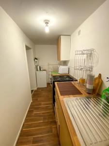 a kitchen with a counter and a stove top oven at Preston Stanley 1 Bed Flat 3a in Preston