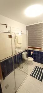 a bathroom with a glass shower and a toilet at Casa da Croa in Laxe +16 photos