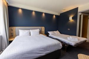 Säng eller sängar i ett rum på Holiday Inn Express Norwich, an IHG Hotel