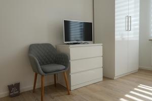 TV a/nebo společenská místnost v ubytování Modern Home Check-in & chill down auf 65 qm²