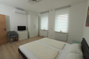 Postel nebo postele na pokoji v ubytování Modern Home Check-in & chill down auf 65 qm²