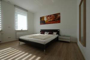 Postel nebo postele na pokoji v ubytování Modern Home Check-in & chill down auf 65 qm²