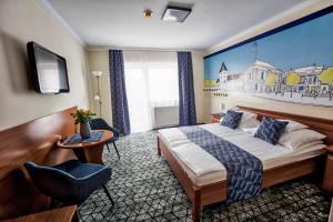 Postel nebo postele na pokoji v ubytování Hotel Viktória