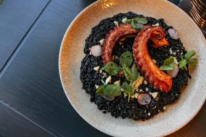 a plate of food with a snake on top at Hotel Fontan Reforma Centro Historico in Mexico City +116 photos