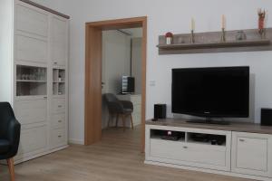 TV a/nebo společenská místnost v ubytování Modern Home Check-in & chill down auf 65 qm²