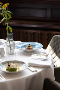 A restaurant or other place to eat at Karma Salford Hall Hotel 