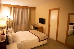 Postel nebo postele na pokoji v ubytování Trakya City Hotel