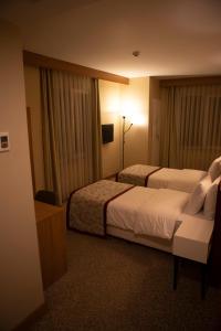 Postel nebo postele na pokoji v ubytování Trakya City Hotel