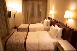 Postel nebo postele na pokoji v ubytování Trakya City Hotel