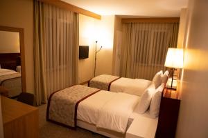 Postel nebo postele na pokoji v ubytování Trakya City Hotel