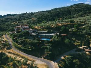an aerial view of a house on a mountain at Agriturismo Borgo Mocale in Castelfranco di Sopra