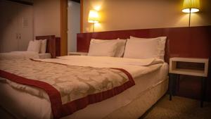Postel nebo postele na pokoji v ubytování Trakya City Hotel