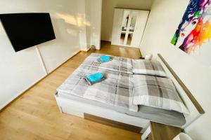 a bedroom with a bed with two pillows on it at FeWo Seestadt mit Balkon in Goslar