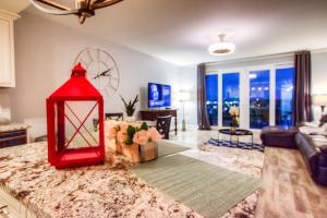 a living room with a red lantern on a counter at BRAND NEW! Laketown Wharf 633! Amazing 3 BD, Great Location, And Awesome Amenities! in Panama City Beach