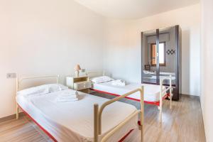 Postel nebo postele na pokoji v ubytování Casa Vacanza S'Archittu